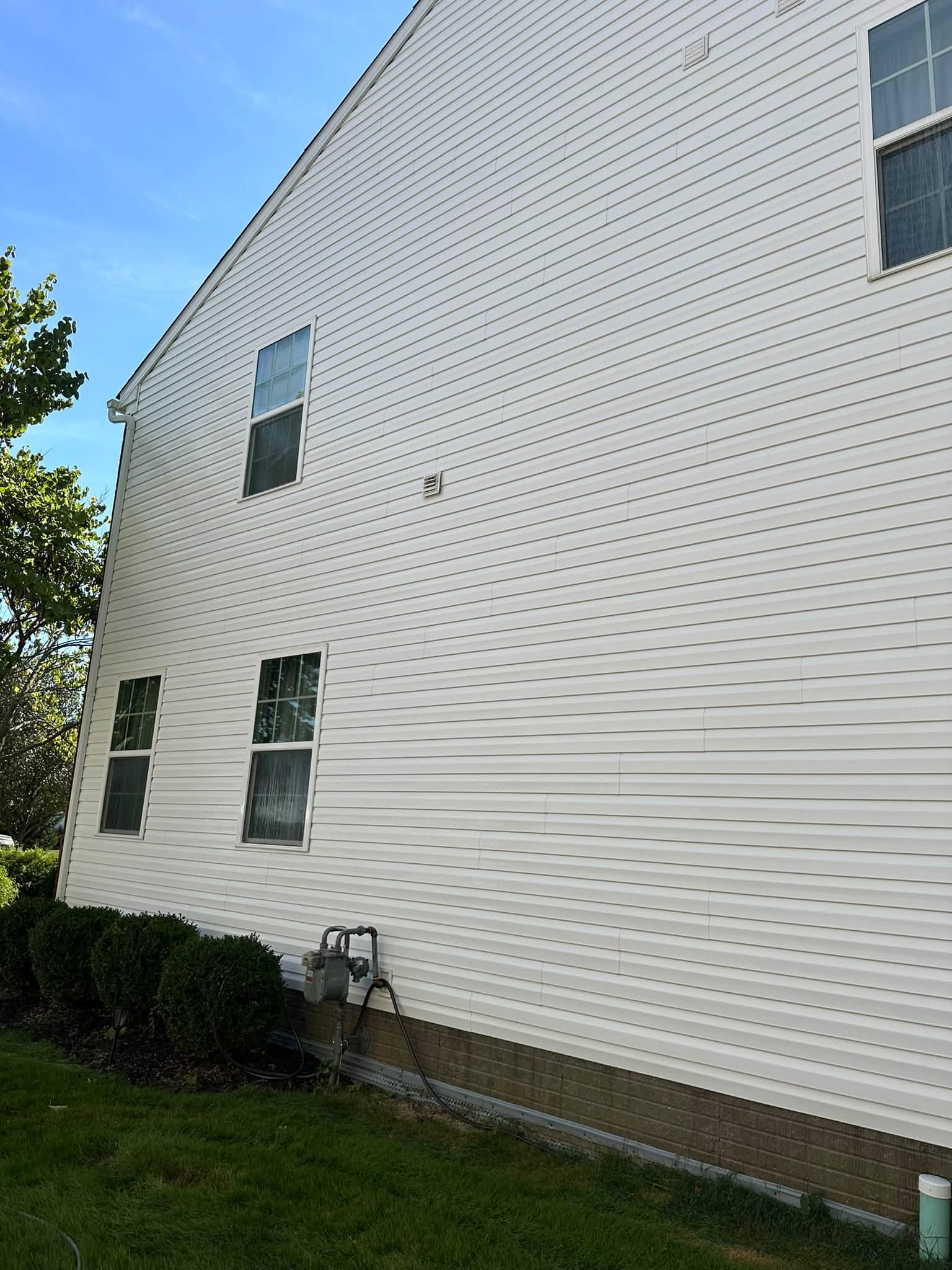 White house siding and windows from Wysocky's exterior work